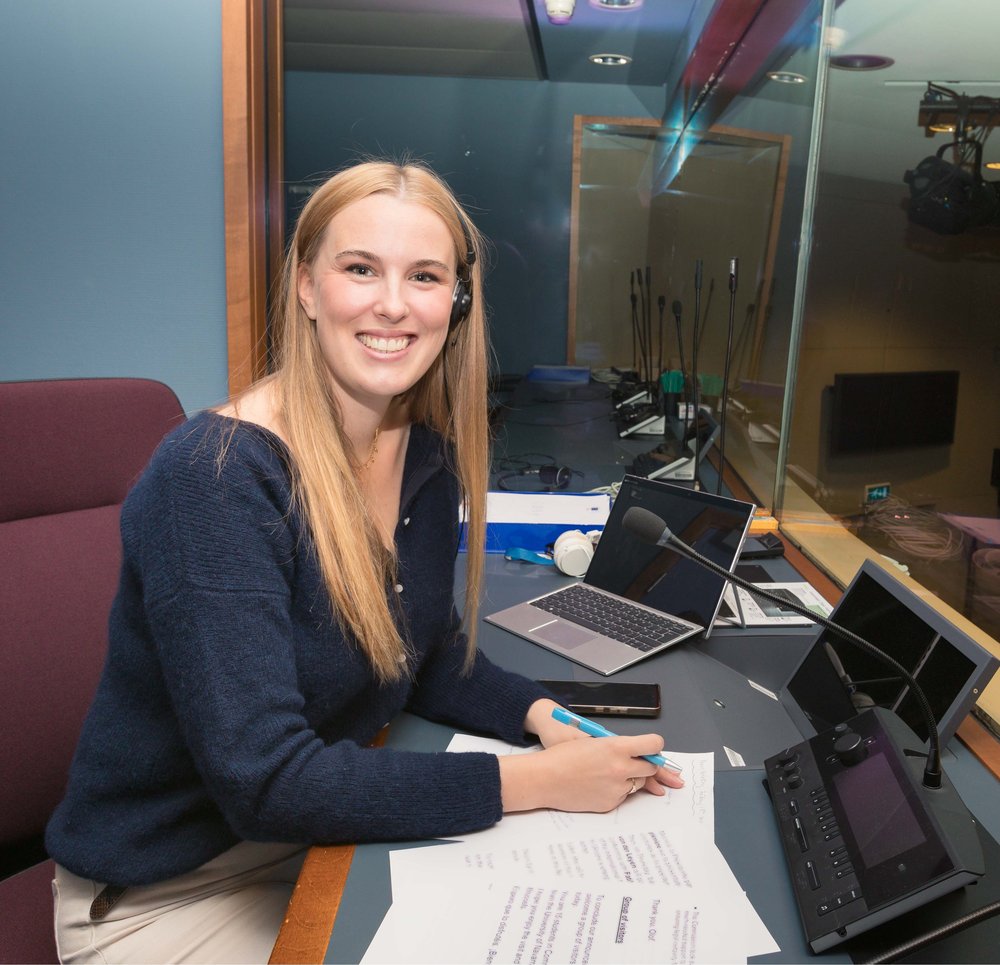 Headshot of Aisling Ní Chatháin at her desk