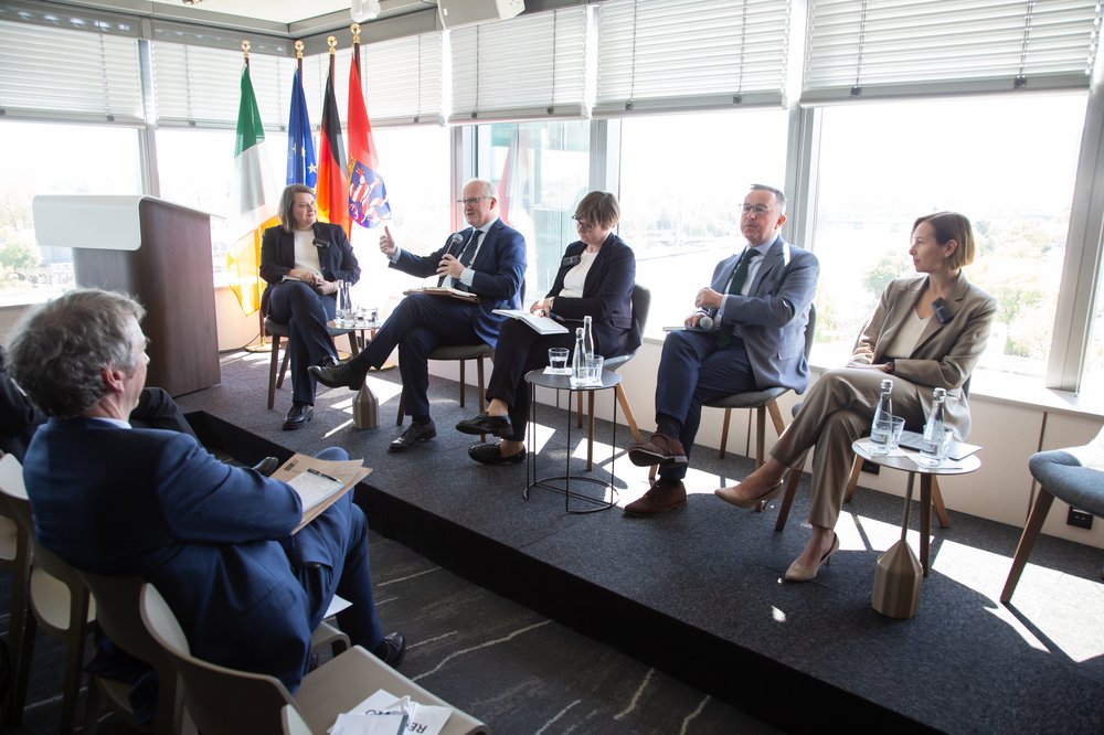 Stage view of panel discussion on Macroeconomic and Global Policy Environment, moderated by Jana Randow, Senior European Economics Correspondent for Bloomberg. The panelists are Emma Cunningham, Director General of International and EU Division at the Department of Finance, Ireland, Philip Lane, Member of the Executive Board at the European Central Bank, Brian Hayes, CEO at the Banking and Payments Federation of Ireland and Monika Sus, Associate Professor at the Institute of Political Studies, Polish Academy of Sciences.