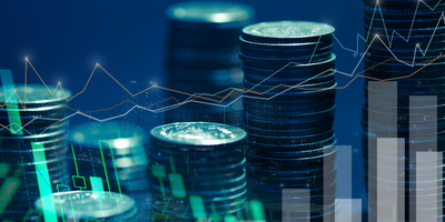 Coins and graphs on a blue background representing financial technology