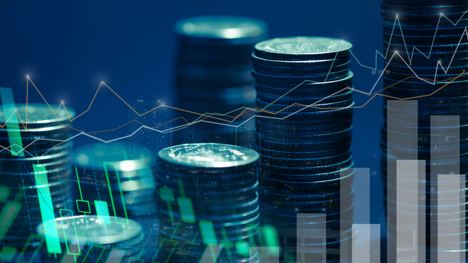Coins and bar charts against a blue backdrop