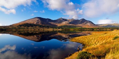 View across a lake of a mountain in Ireland