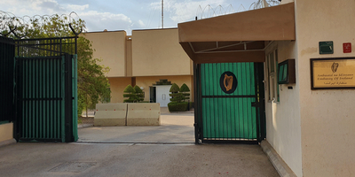 View of the front of the Embassy building and gates.