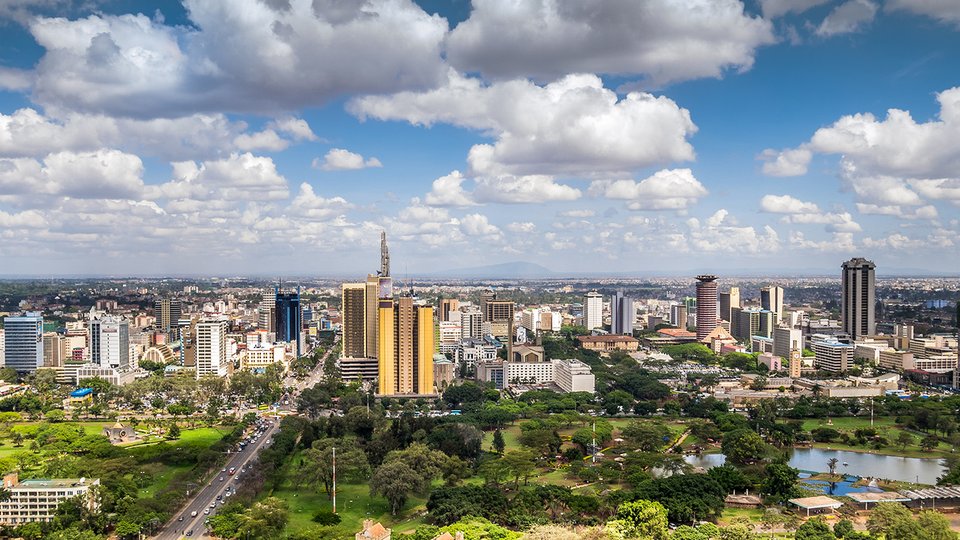 Arial view of Nairobi with green fields and tower blocks