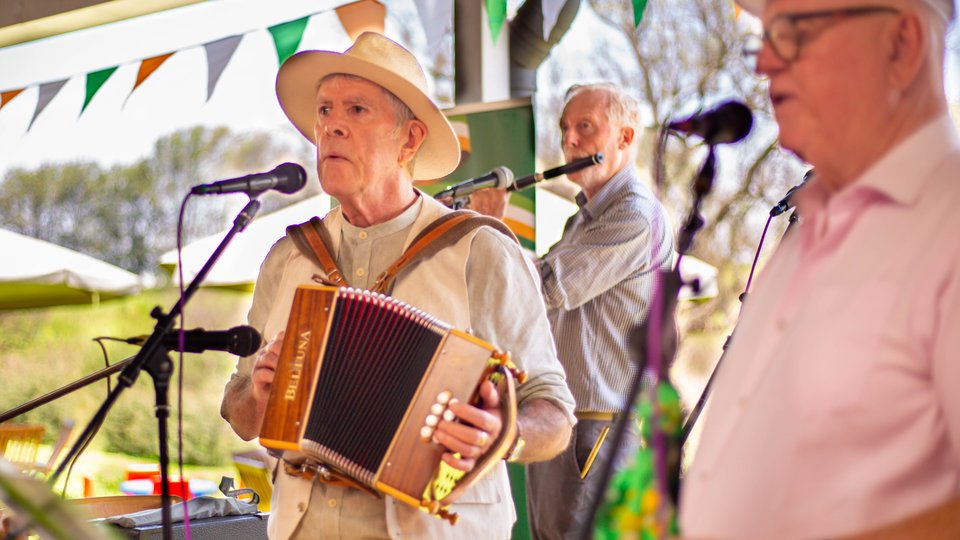 People singing and playing traditional Irish music