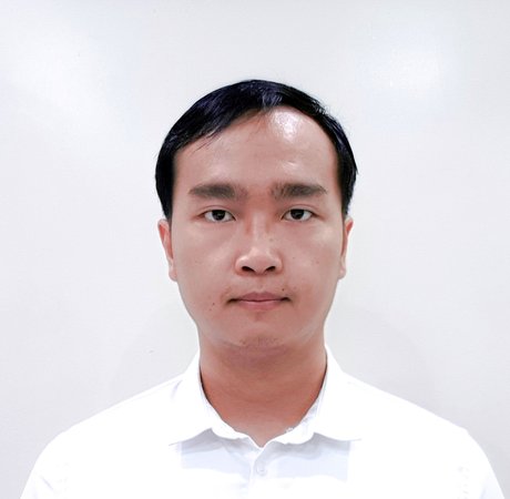 A headshot of a man looking into the camera.