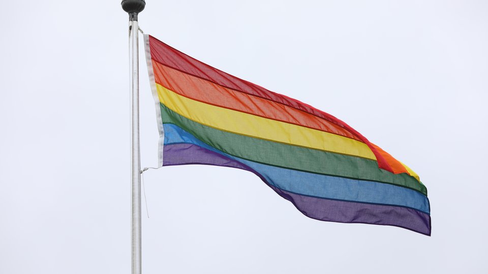A rainbow flag flying