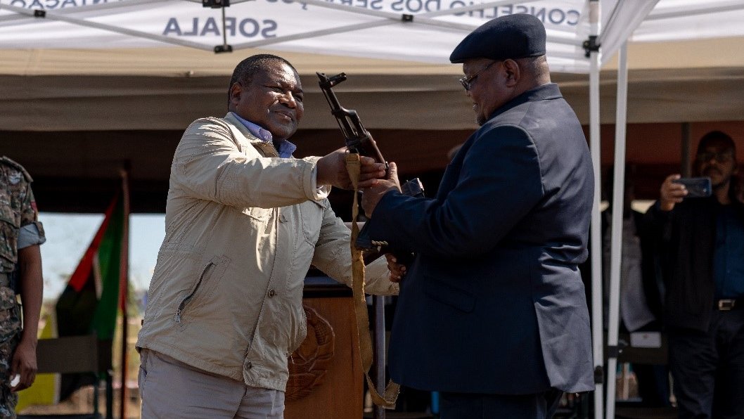 Leader of Renamo Ossufo Momade symbolically hands over the last weapon to President Filipe Nyusi, Sofala province, central Mozambique