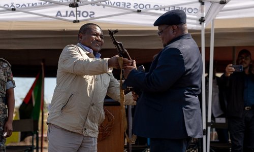 Leader of Renamo Ossufo Momade symbolically hands over the last weapon to President Filipe Nyusi, Sofala province, central Mozambique