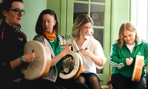 a group of people playing the bowran