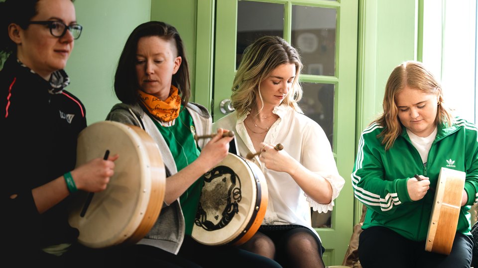 a group of people playing the bowran