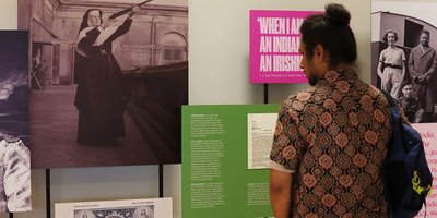 A man looking at exhibition panels