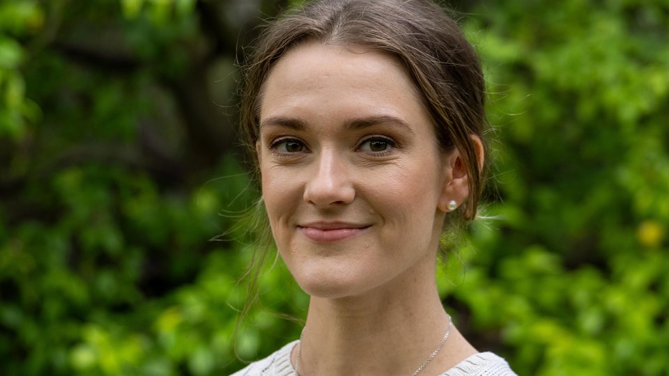 Headshot of Marie Claire Hughes