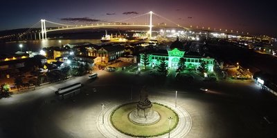 Praça da Independência in Maputo, Mozambique lit up green at night.
