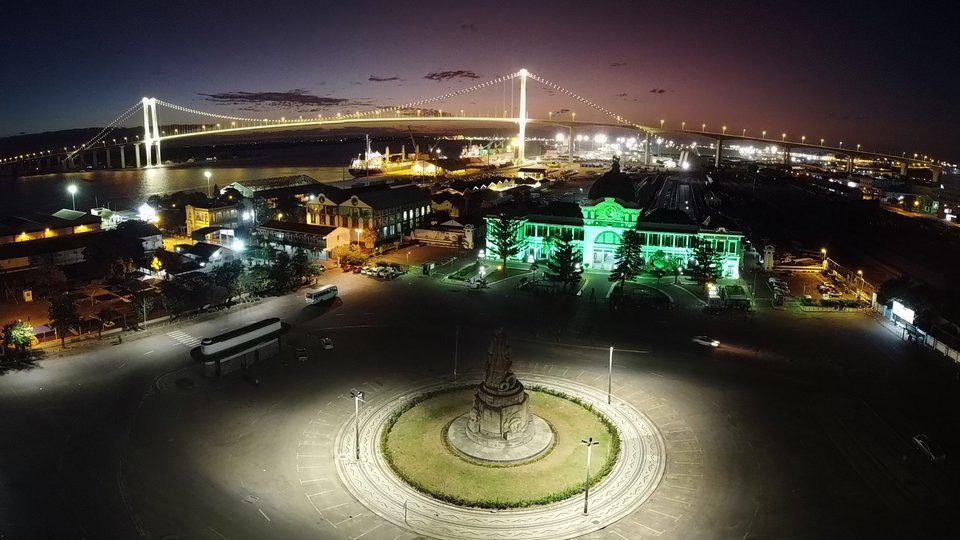 Praça da Independência in Maputo, Mozambique lit up green at night.