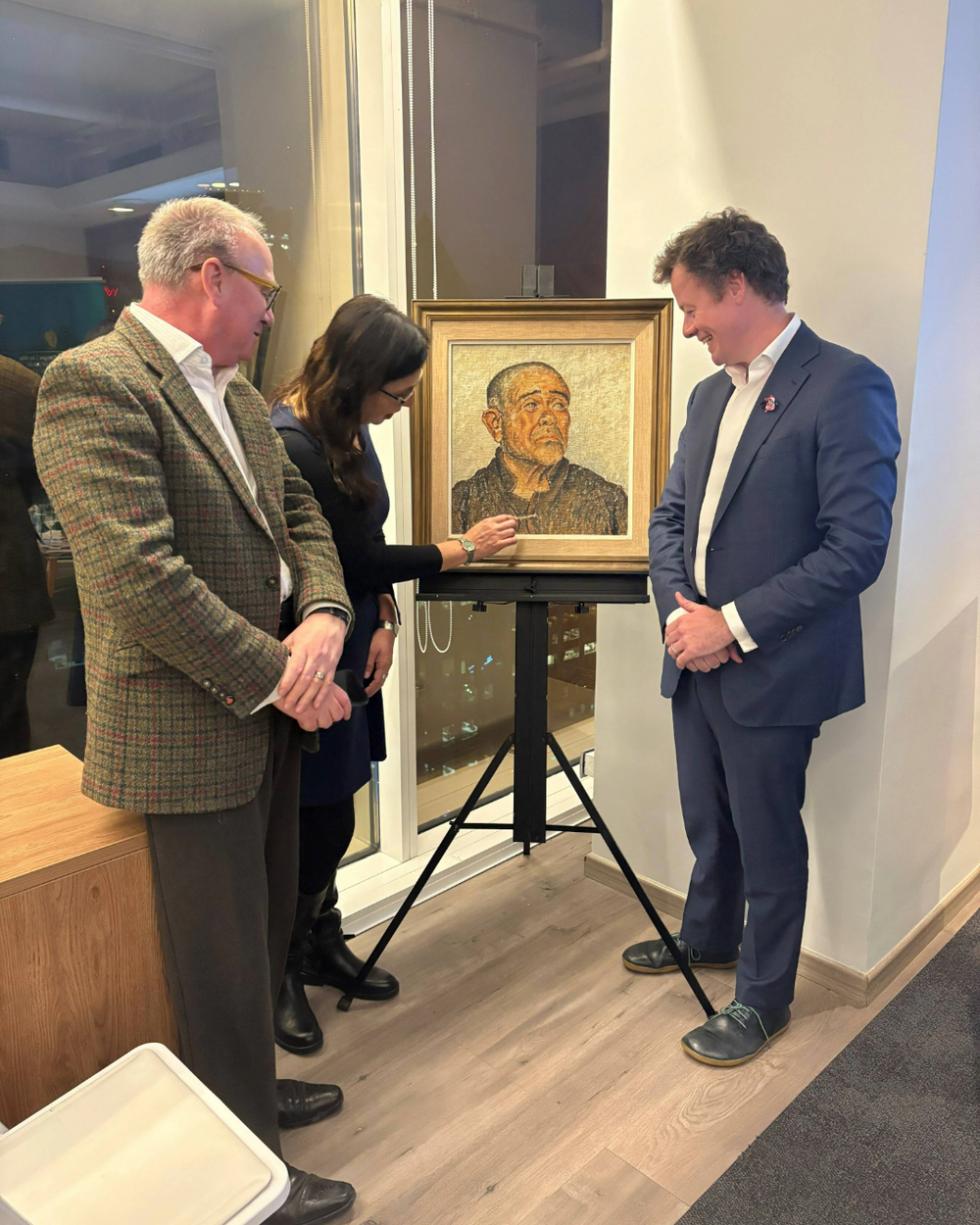 Marcela Küpfer, Gregory Dune and Ambassador Hatchell with the painting El Loco