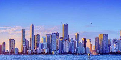 Miami's cityscape skyline with high rise buildings at sunrise.