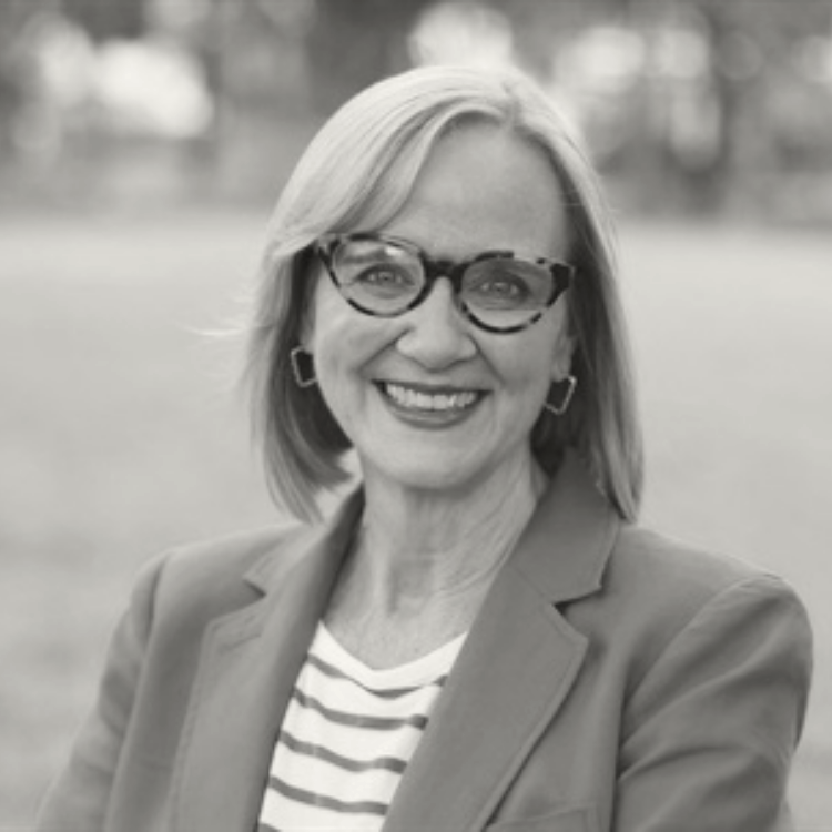 Woman with glasses smiling