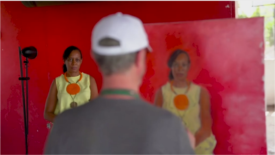 Artist Mick O Dea painting a portrait of a woman who is sitting for him.