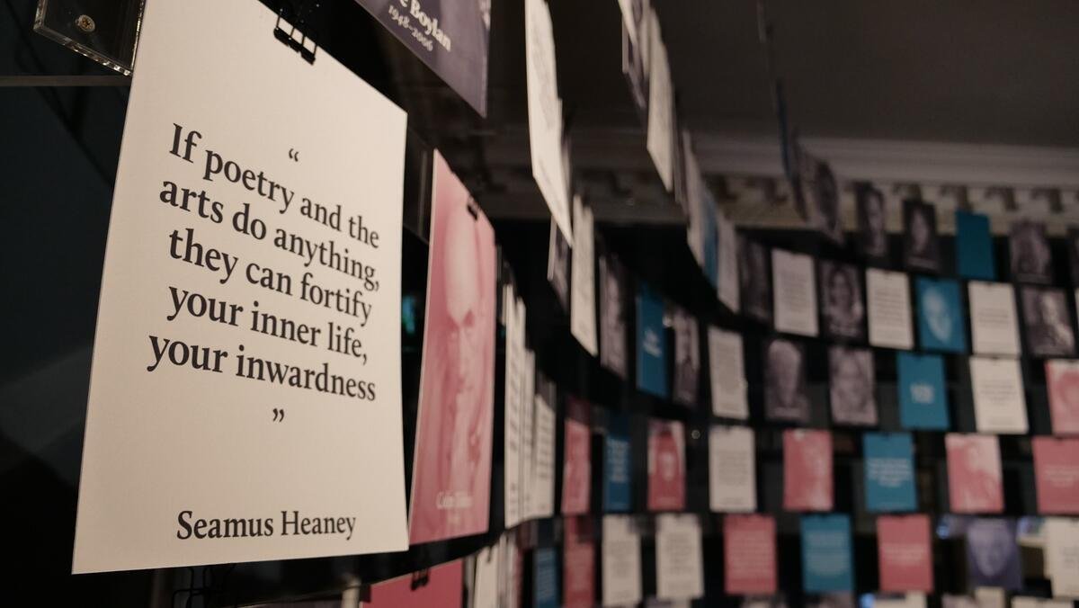 Display of books in the Museum of Literature, showcasing a poster with a quote reading: "If poetry and the arts do anything, they can fortify your inner life, your inwardness" - Seamus Heaney