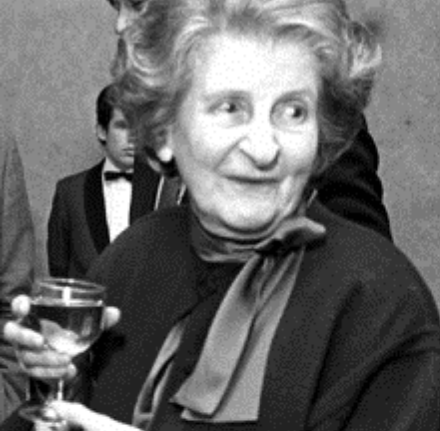 Woman smiling, looking to the right