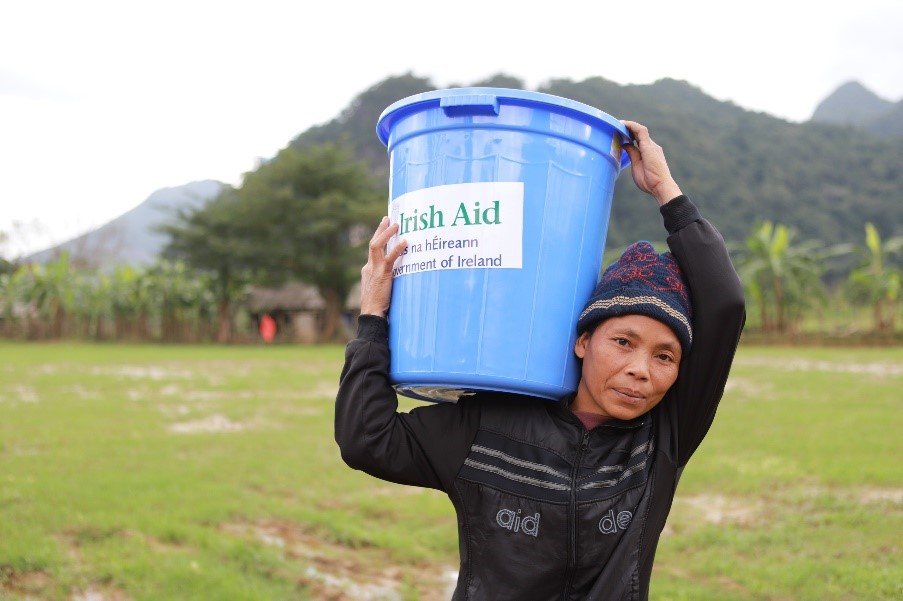 Ms Ho Thi Pu, Truong Son Commune, Quang Binh Province, Central Vietnam receiving an emergency packet following devastating floods.