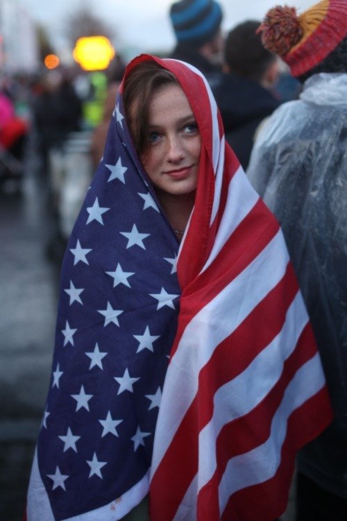 girl wrapped in American flag
