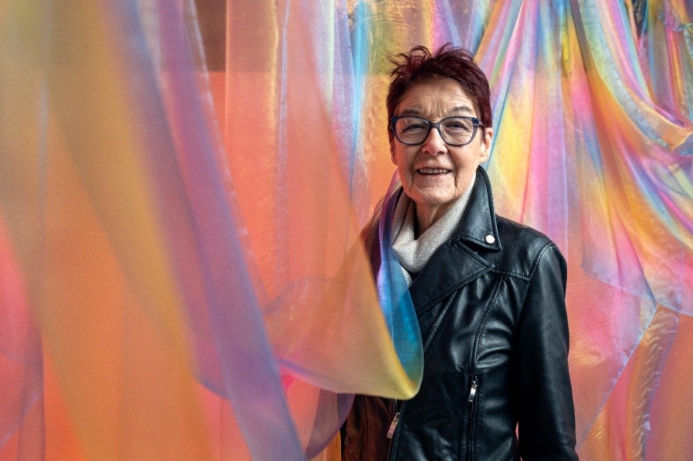 Campaigner, LGBTIQ+ and feminist activist, Ailbhe Smyth framed in colourful drapes