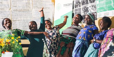 A group of women in Rwanda celebrating as part of a leadership skills group.