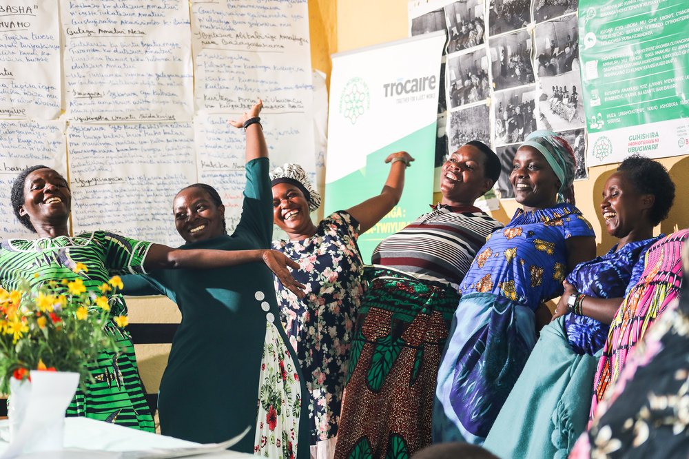A group of women in Rwanda celebrating as part of a leadership skills group.