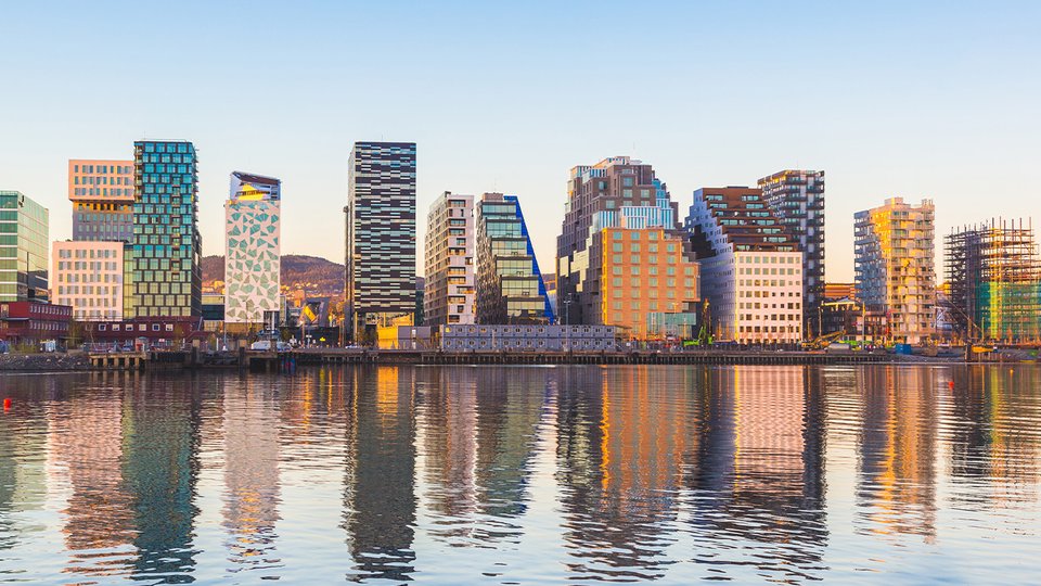 Skyline of Oslo reflected in the river