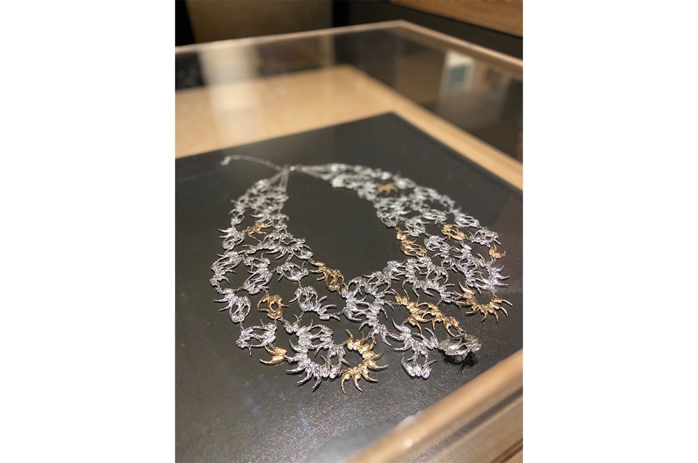 A necklace inspired by the lower jaw of a rat, designed in multiples to create floral symmetry.