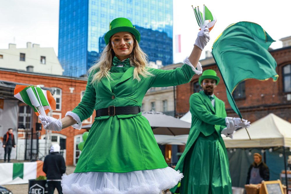 Figures dressed in green with Irish and green flags