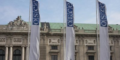 OSCE flags flying outside the OSCE building in Vienna.