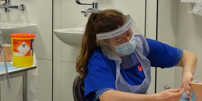 Nurse injecting a patient