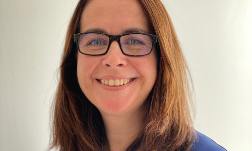 Dr Teresa Lambe in front of a blank background
