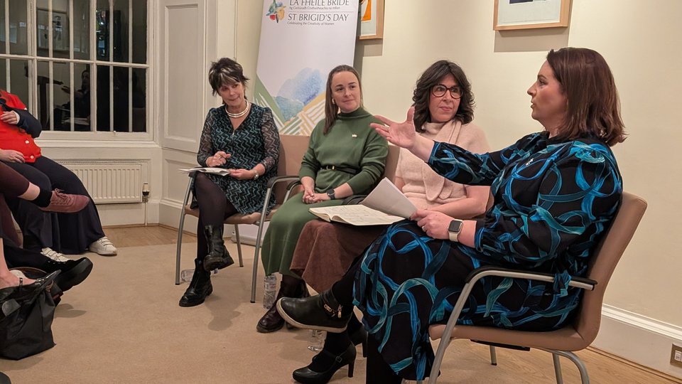 Panelists sitting on stage