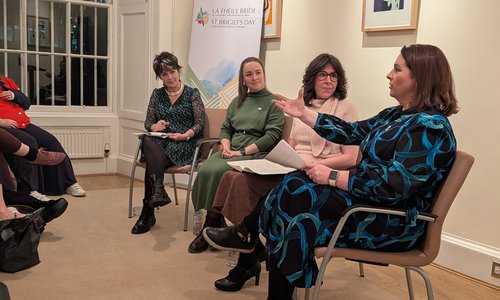 Panelists sitting on stage