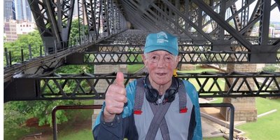 Pat Lonergan in his 80s standing on Sydney Harbour Bridge