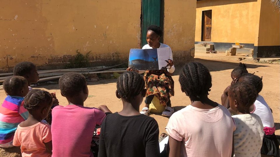 Peggy teaching little ones to read