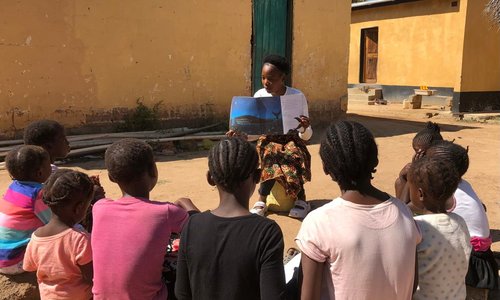 Peggy teaching little ones to read