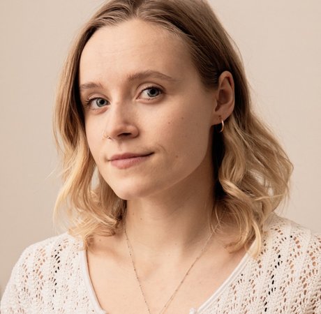 Woman smiling to the right