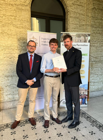 Cal Healy receives his certificate of lay formation from Director of Lay Studies Eoin Mc Cormack (left) and Rector Fr. Paul Finnerty (right)