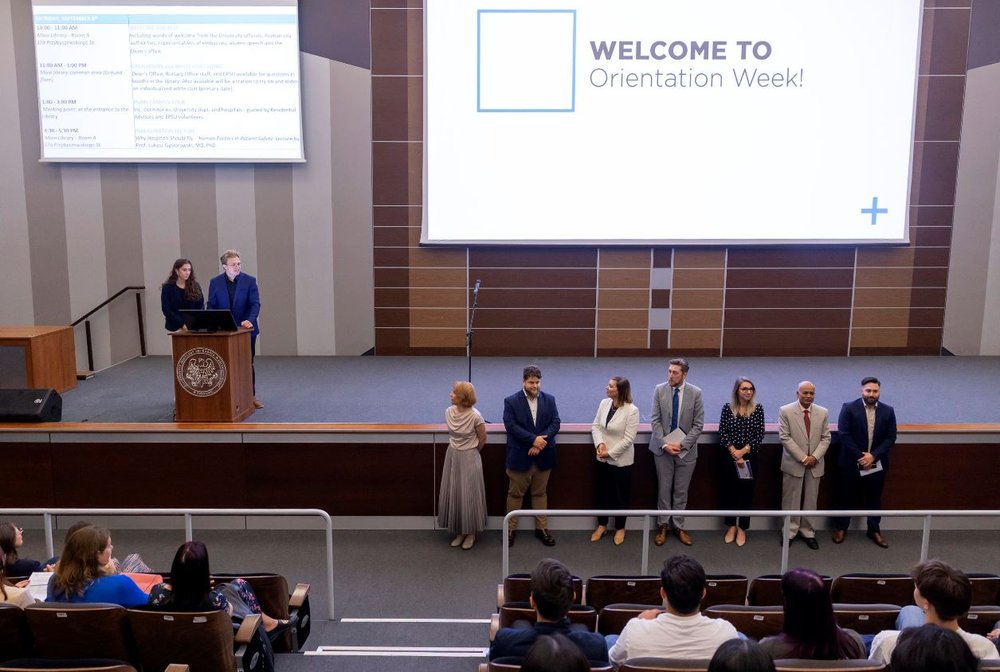 A group of people in a university lecture hall