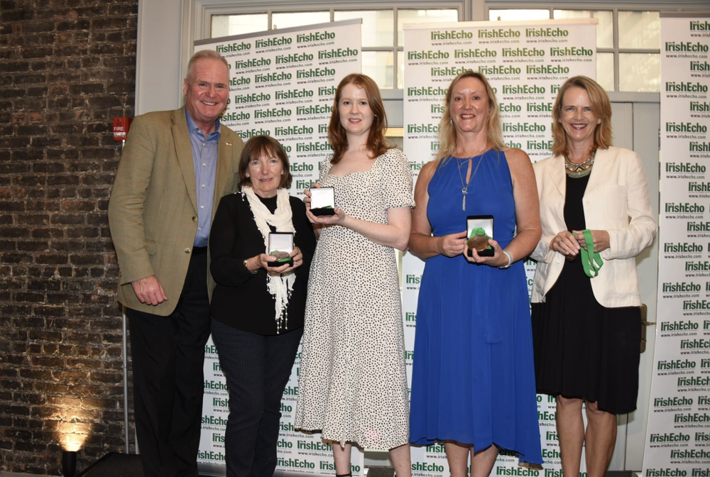 Caoimhe Nic Giollarnáith receiving a 'Rebuilders Medal' from the Irish Echo in New York, for her work promoting the Irish language during the pandemic.