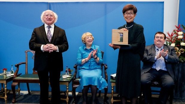 A PDSA award being presented by President Michael D Higgins