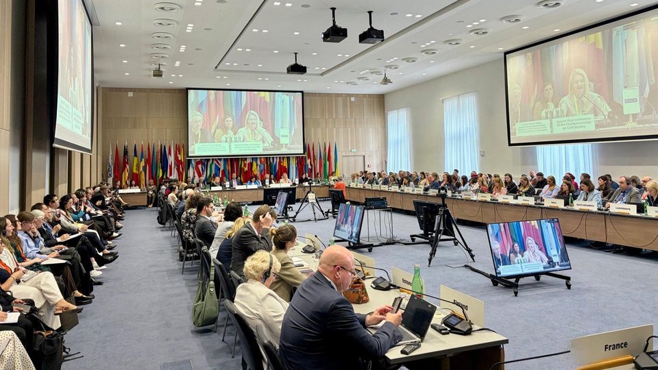 People sitting in a conference room