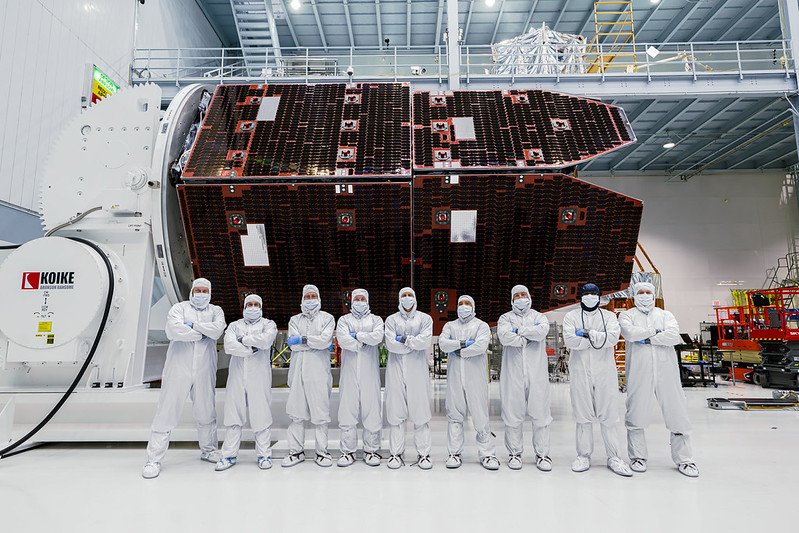 Roman solar installation with scientists in white protective suits