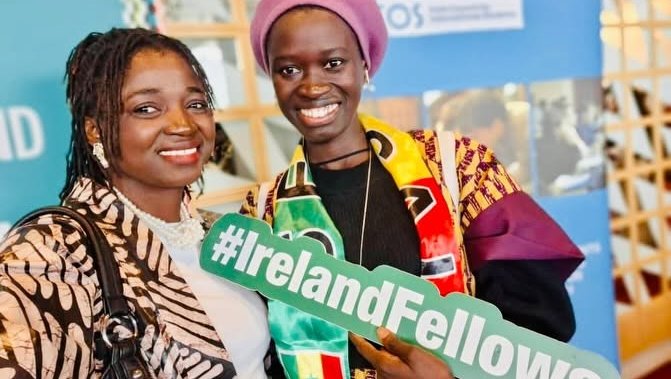Two Senegalese fellows holding signs