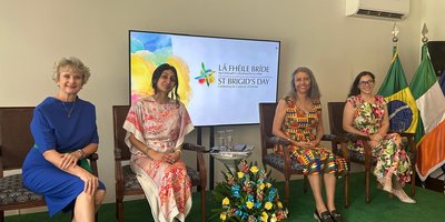 Four women sitting on stage for a St Brigid's Day panel event