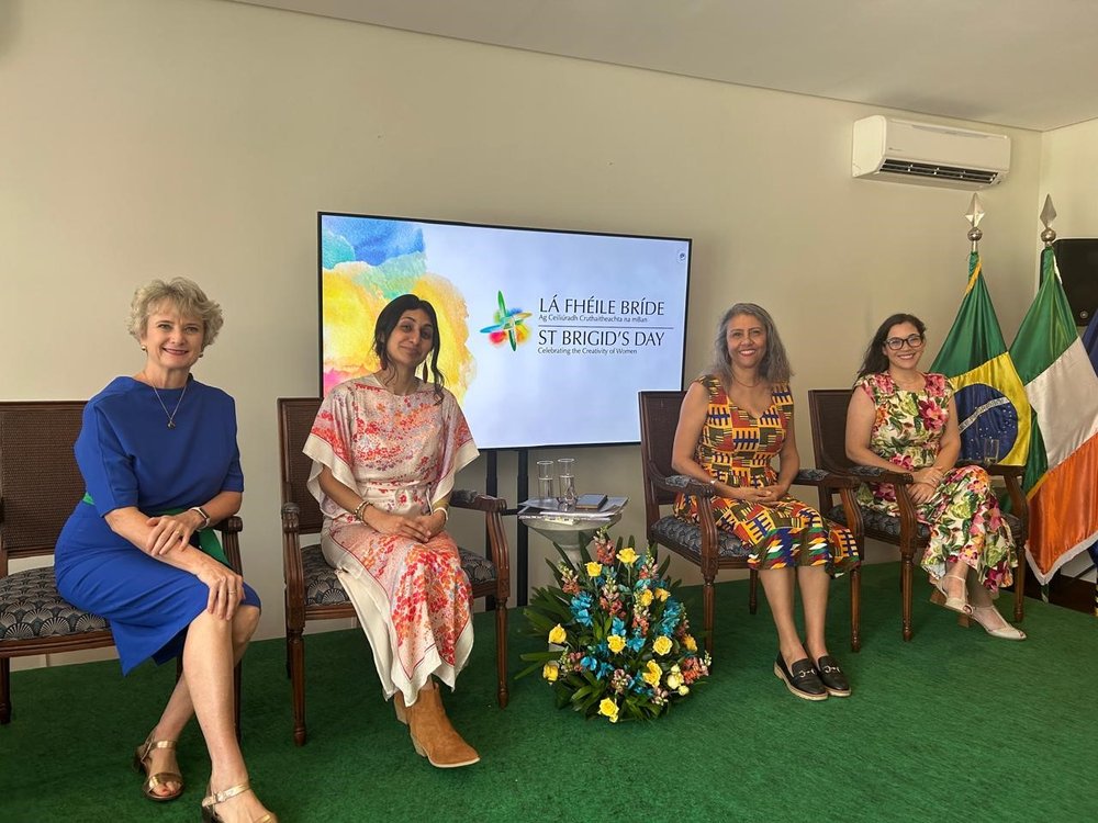 Women sitting on a stage at a St Brigid's Day panel